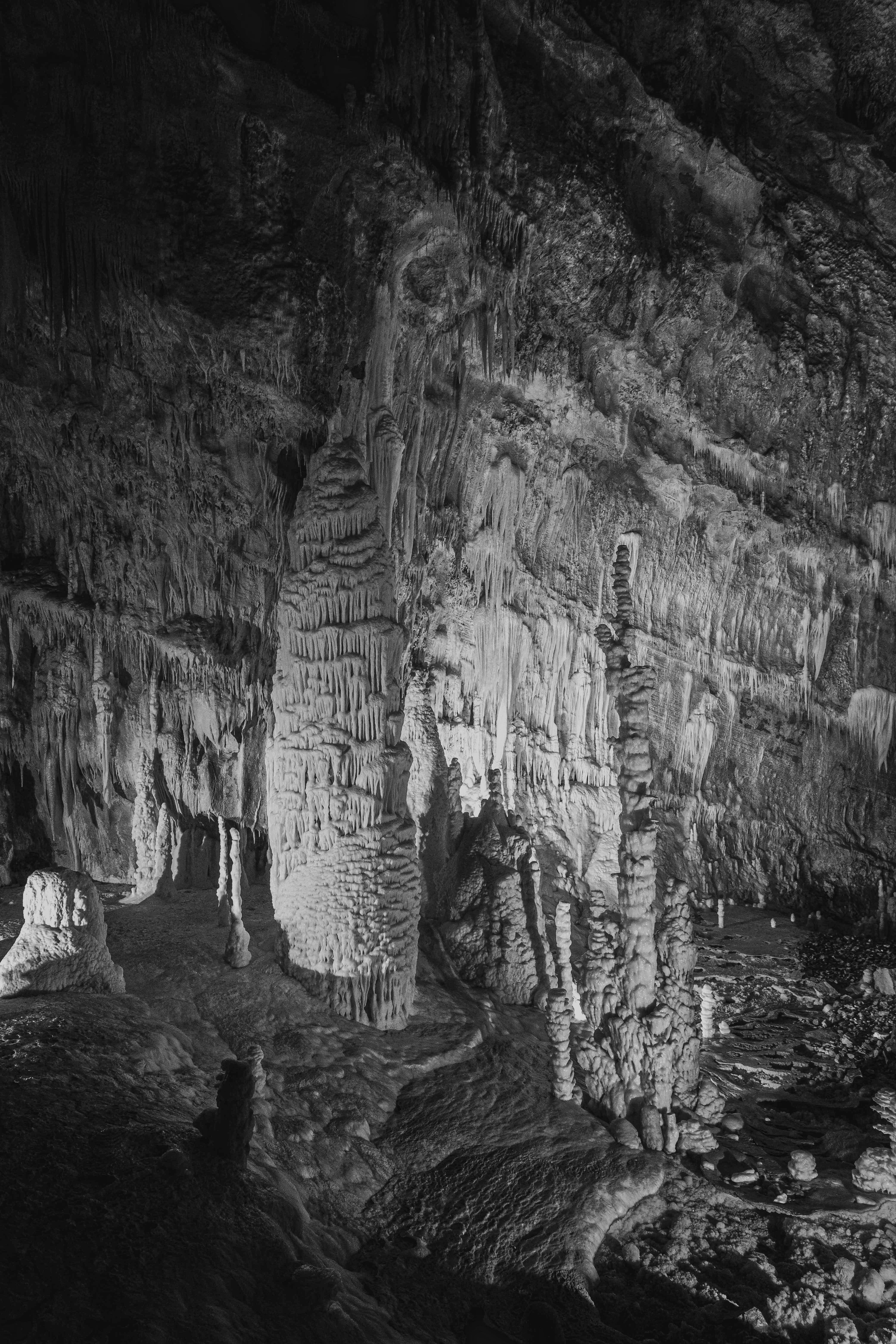 a group of people standing in a cave
